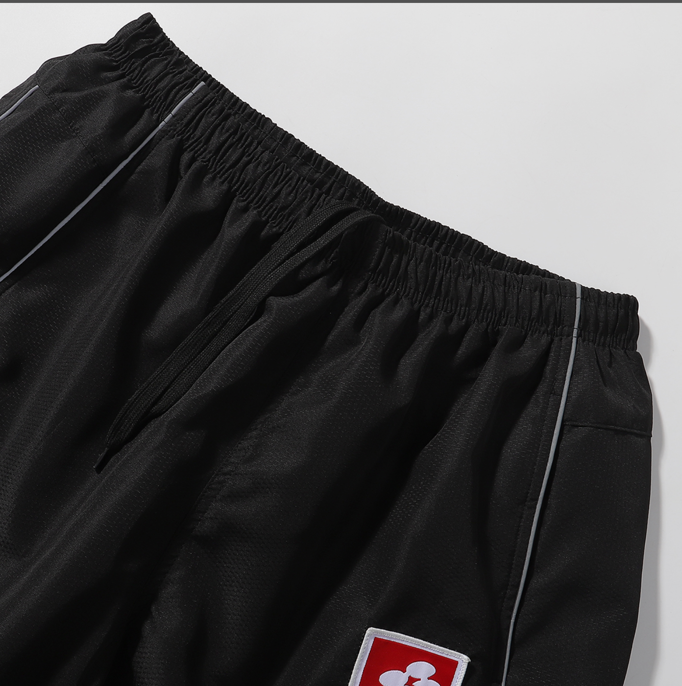 PANTS SUPREME REFLECTANTE
