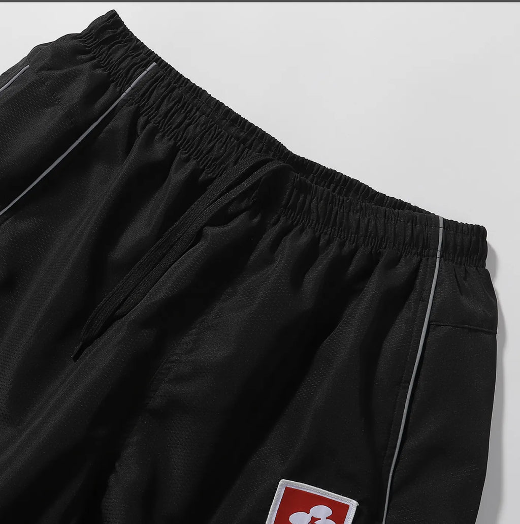 PANTS SUPREME REFLECTANTE