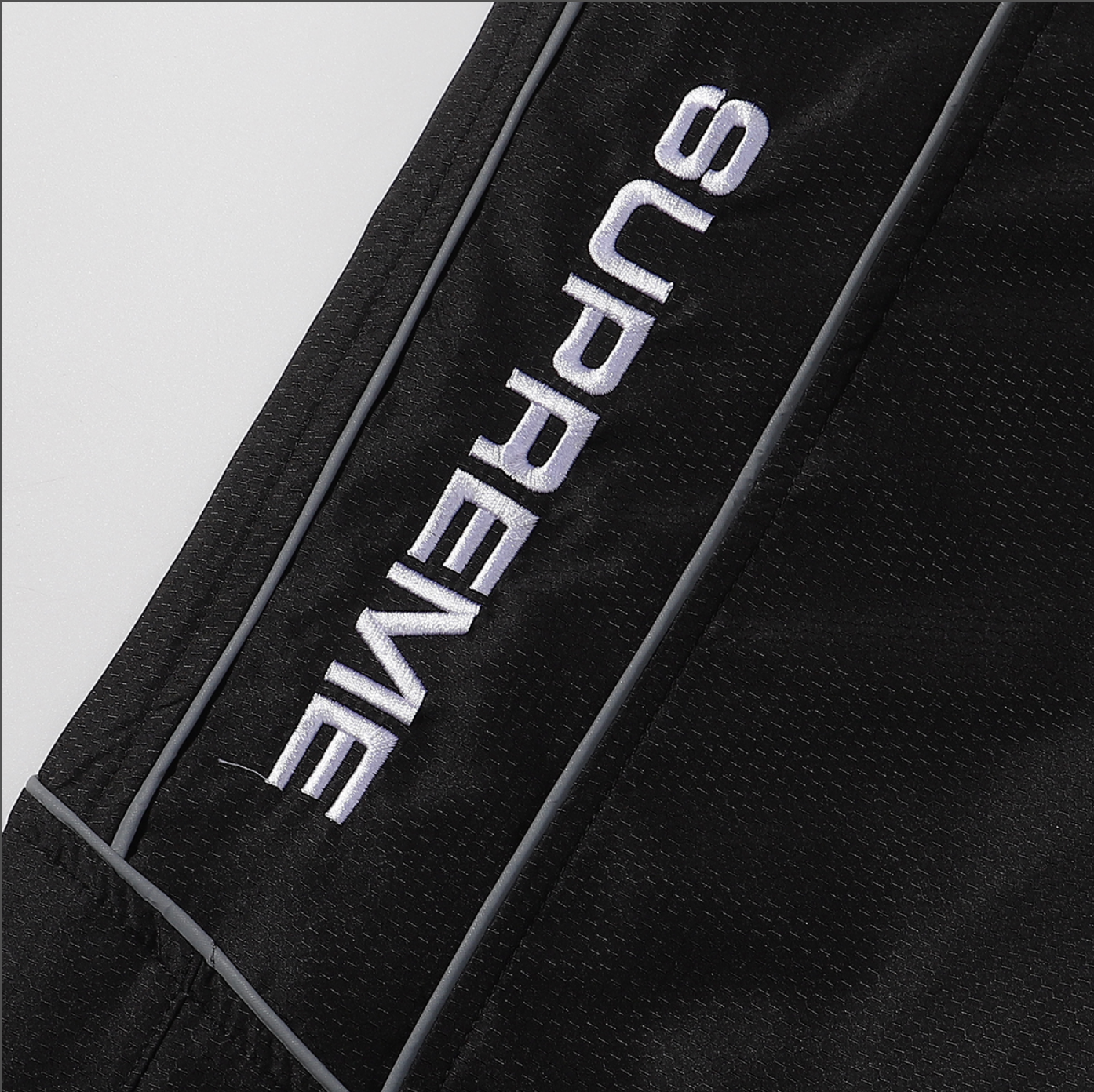 PANTS SUPREME REFLECTANTE