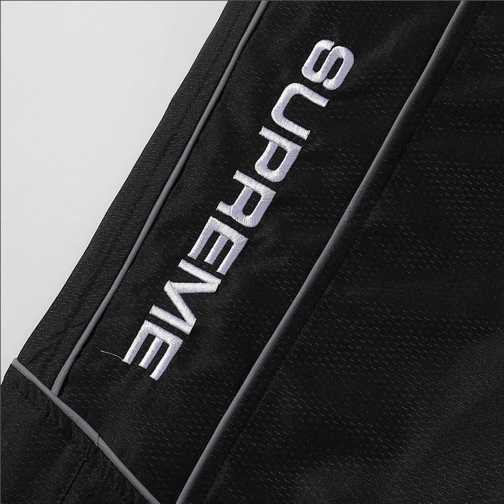 PANTS SUPREME REFLECTANTE