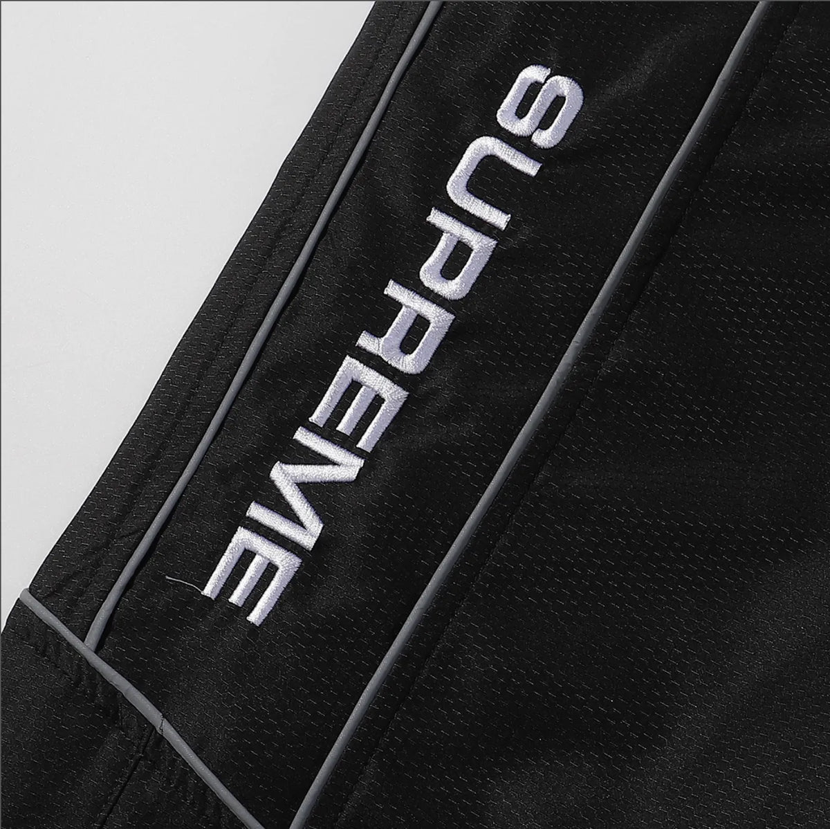 PANTS SUPREME REFLECTANTE