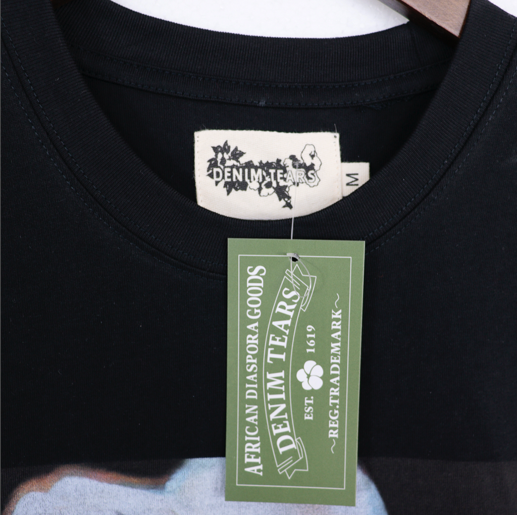 PLAYERA DENIM TEARS FLORAL LOGO