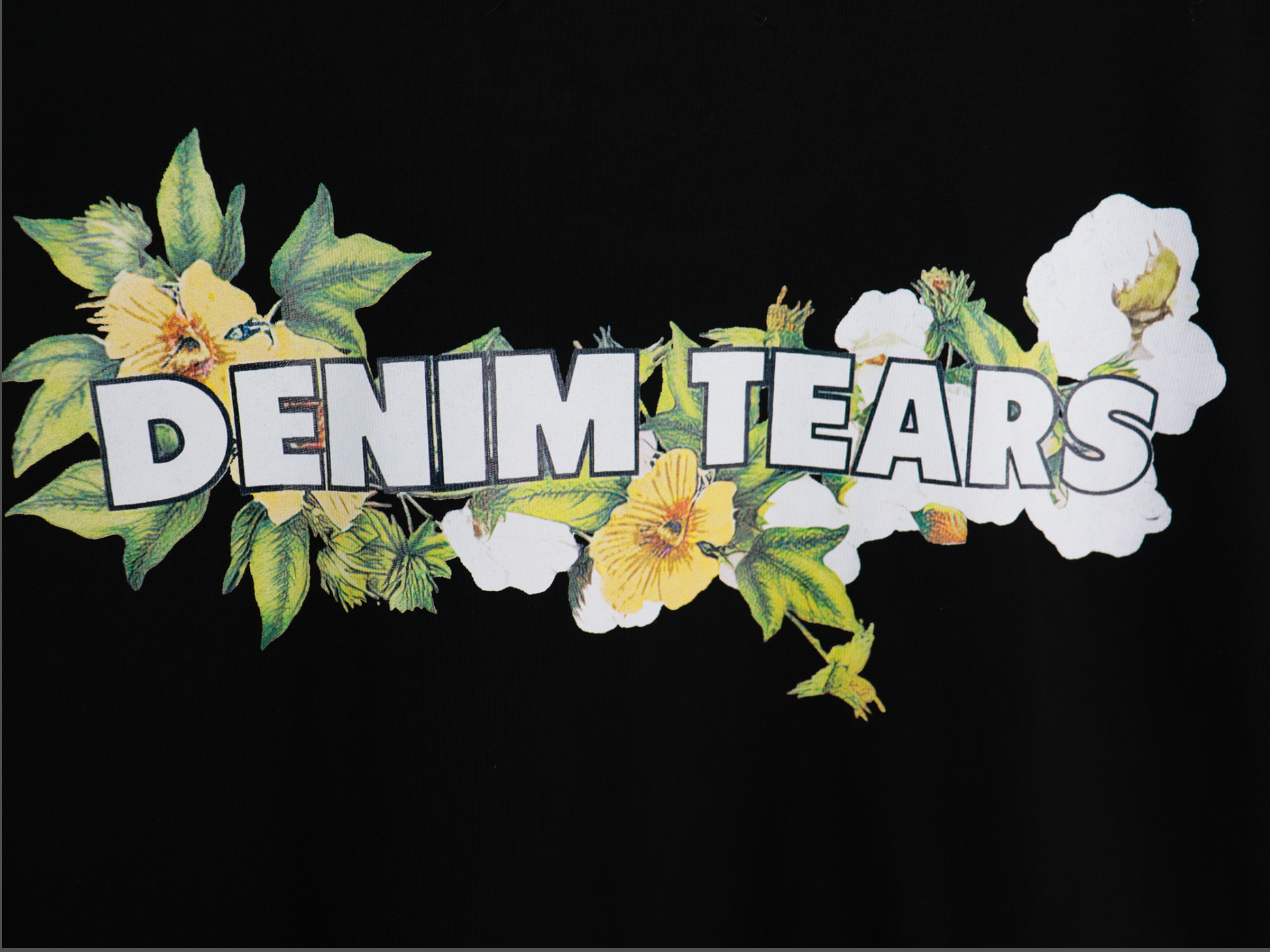 PLAYERA DENIM TEARS FLORAL LOGO