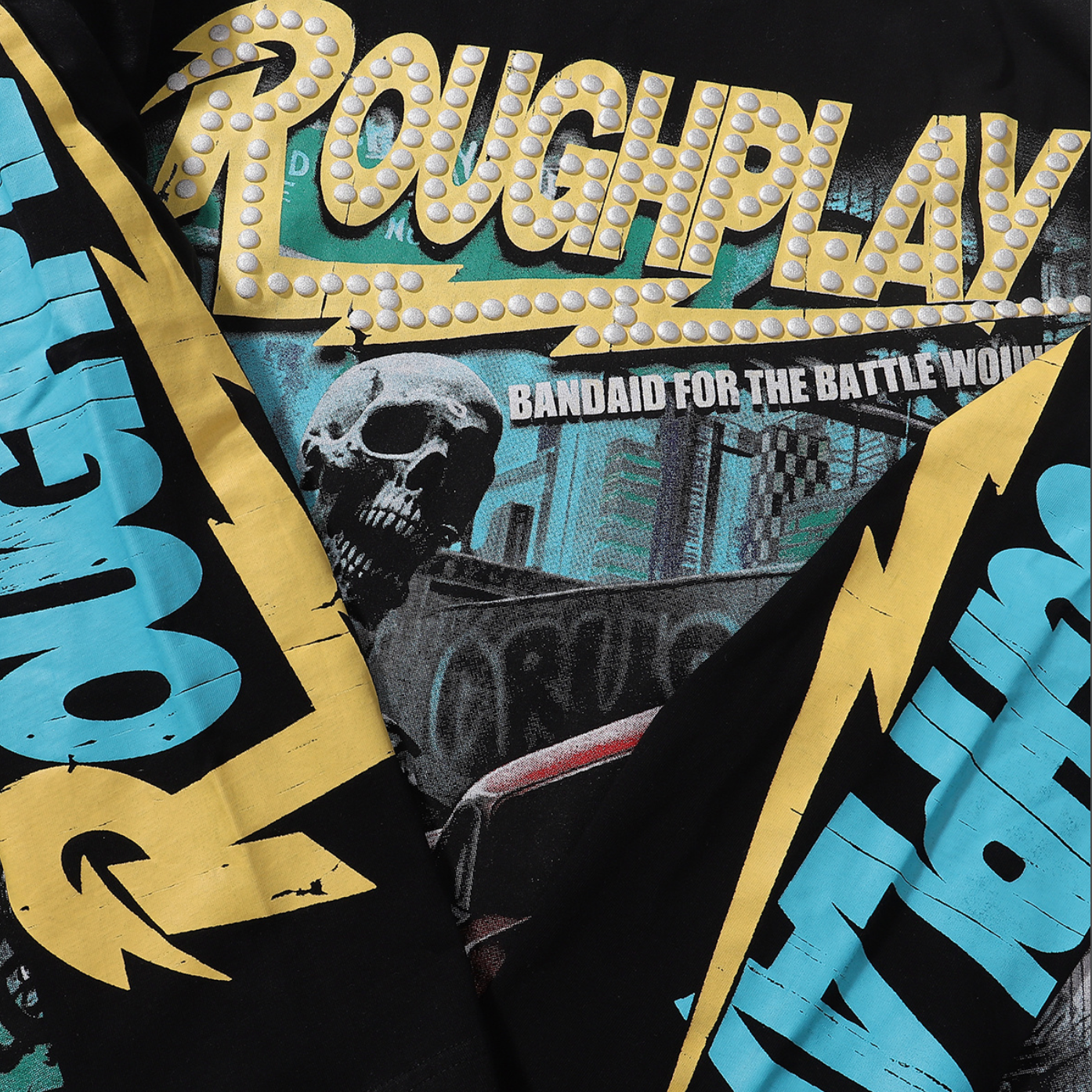 PLAYERA ROUGH PLAY BANDAID FOR THE BATTLE